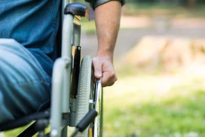 upclose image of man in wheelchair