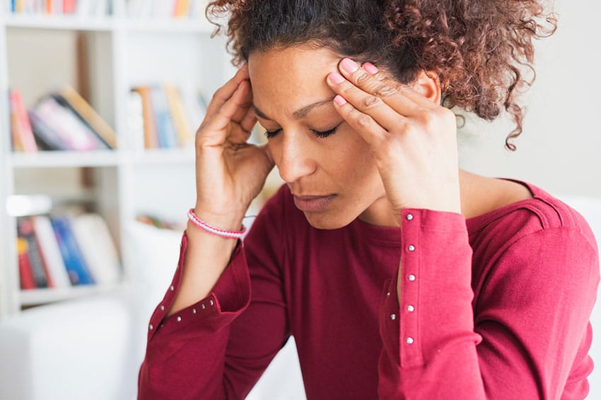 woman suffering from a migraine headache